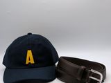 two hats and a belt are sitting on a white surface