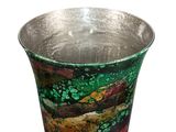 a vase that is sitting on a white surface