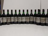 six bottles of wine are lined up in a row on a table