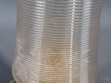 silver plated glass vase on stand on blue background