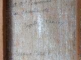 an old picture of a wooden frame with writing on it