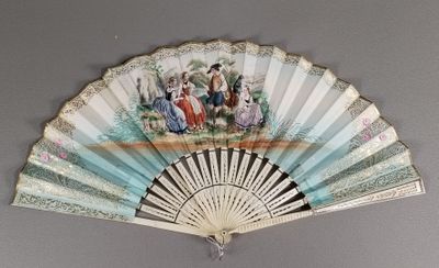 un ventilateur avec un tableau accroché au mur