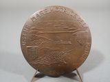 an image of a bronze coin with a picture of a boat on it