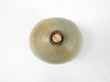 a picture of a green vase with a brown knob