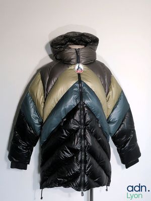 hooded jacket on a mannequin stand against a white wall