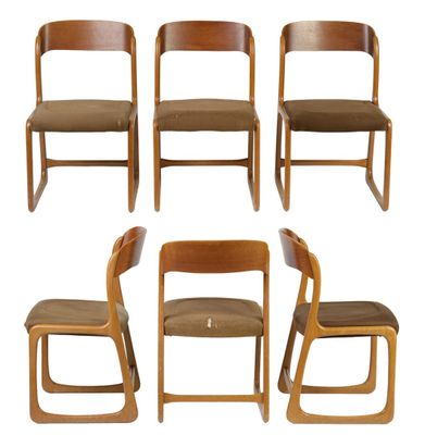 six wooden chairs with brown upholstered seats and a white background