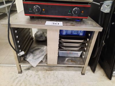 an image of a kitchen with a stove and plates on a table