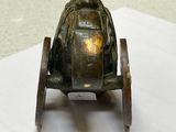 a small metal toy car on a white table