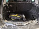 a trunk of a car with luggage inside of it