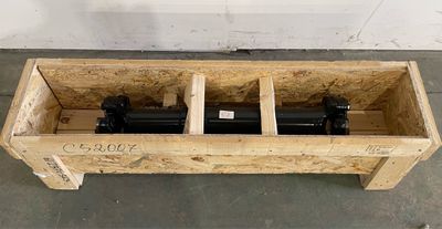 a wooden box with two cylinders inside of it