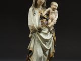 an image of a statue of a woman holding a baby