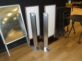three mirrors sitting on the floor next to a radiator