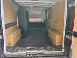 a white van that is open and has some boxes in the back