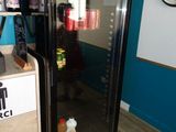 an image of a refrigerator in a room with blue walls