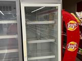 a display case in a grocery store with chips on it