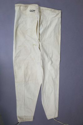 an image of a pair of white pants hanging on a wall