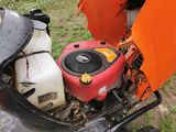 a small engine with a gas can attached to it