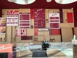 a menu on the wall of a restaurant with a lot of menus on it