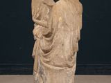 statue of a man and a woman holding a child