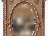 a picture of a mirror with a gold frame