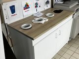 a small kitchen with a refrigerator, stove, microwave, and dishwasher