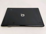 a laptop that is sitting on a white surface