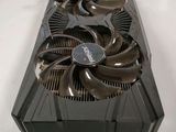 a close up of a video card with a fan on top of it