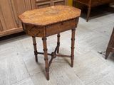 a small table with a wooden top in a room