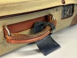 a piece of luggage that has a tag attached to it