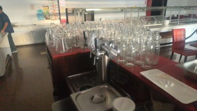 many empty wine glasses on the counter in the kitchen