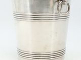 an antique silver plated ice bucket with handles and handles