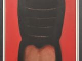 an image of a black and red painting on a red wall
