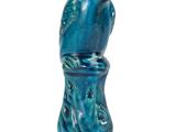a blue vase with a bird on it on a white surface