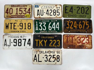 a lot of license plates on display on the wall
