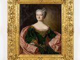 un tableau représentant une femme en robe verte, dans un cadre doré
