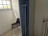 a room with a door and a chair in it