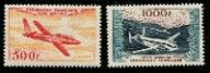 two stamps with a picture of a plane on them