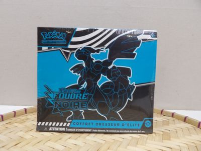 a close up of a box of pokemon trading cards on a table