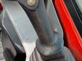 a close up of a control stick in a vehicle