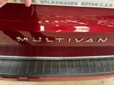 the rear end of a red car with the word multivan written on it