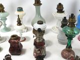many different types of glass vases on the table