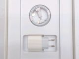 a picture of a white box with a charger inside of it