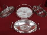 a silver plate and a silver bowl on a red table