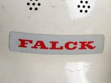 a close up of a falcok label on a machine