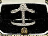 an image of a diamond ring in a black box with a gold ring