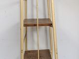 a ladder that is leaning against a white wall