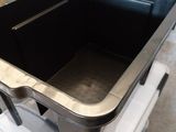a black plastic container sitting on top of a white stove
