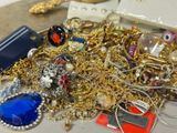 a pile of gold and silver jewelry on a table