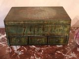 a small wooden box sitting on a table with a bowl
