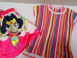 a shirt and a t - shirt with a picture of a girl on it